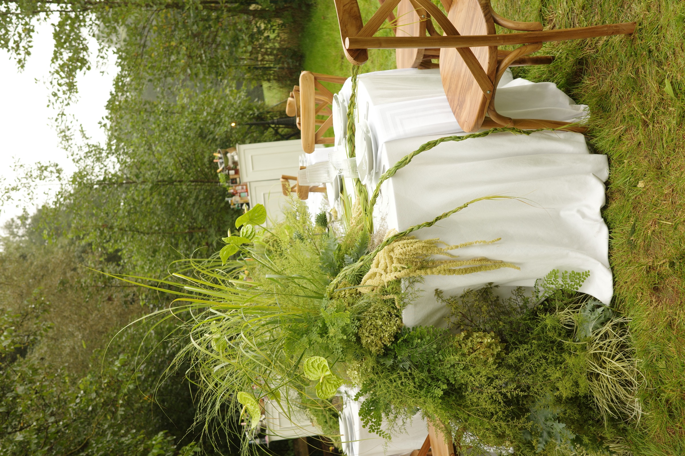 Wild greenery cascading over a meadow table