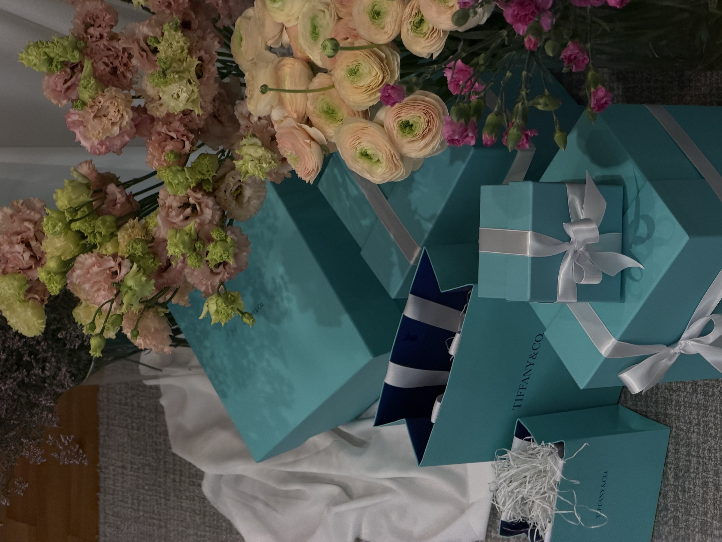 Tiffany & Co. boxes among ranunculus and lisianthus